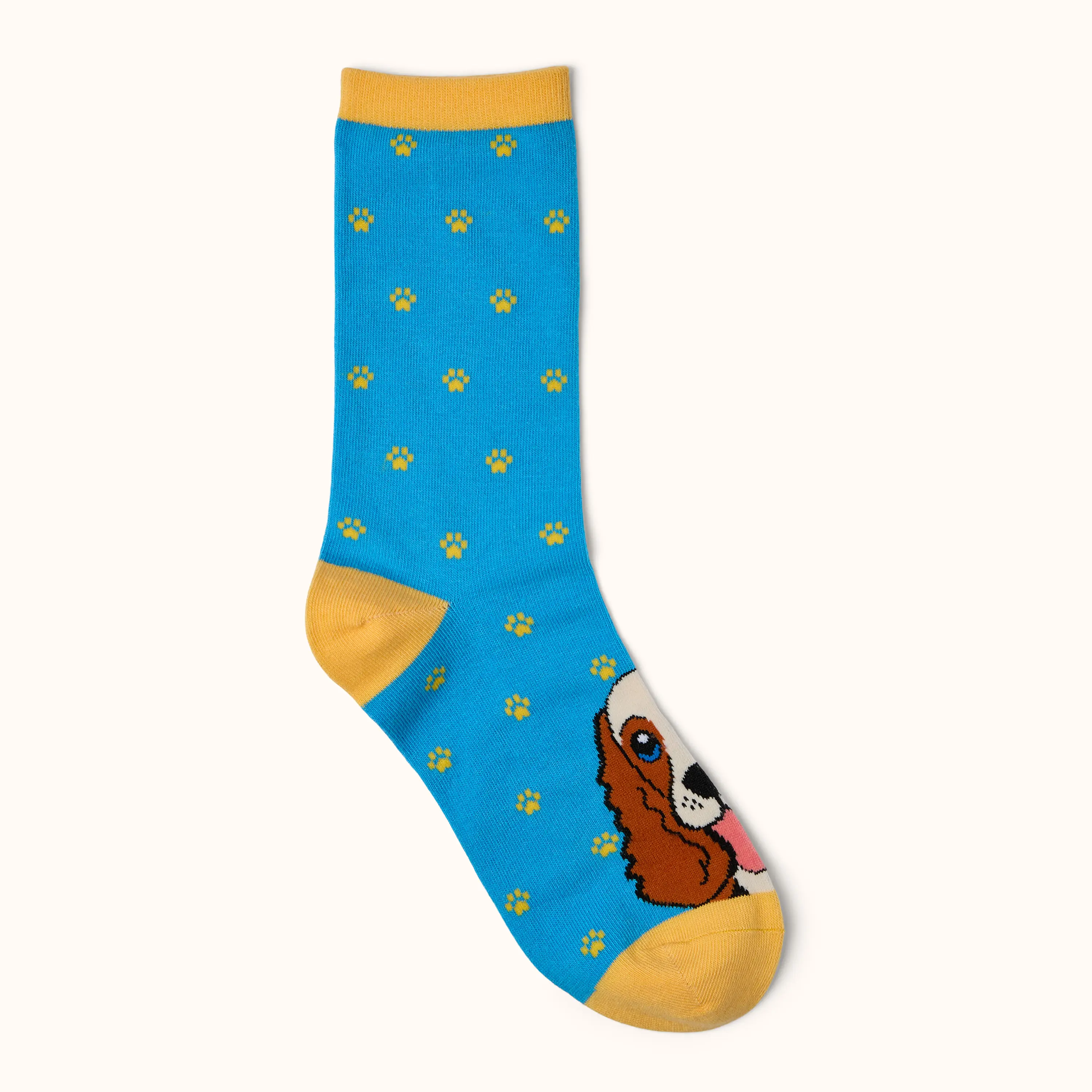 Blue Cross Summer Appeal Dog Ankle Socks featuring a dog design, yellow paw print pattern, and yellow heel, toe and cuff details on a blue background.