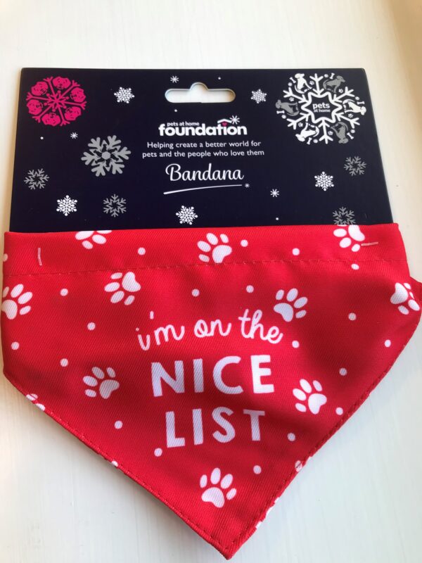 Pets Foundation Santa Paws red bandana with "I'm on the nice list" and white paw prints on the front